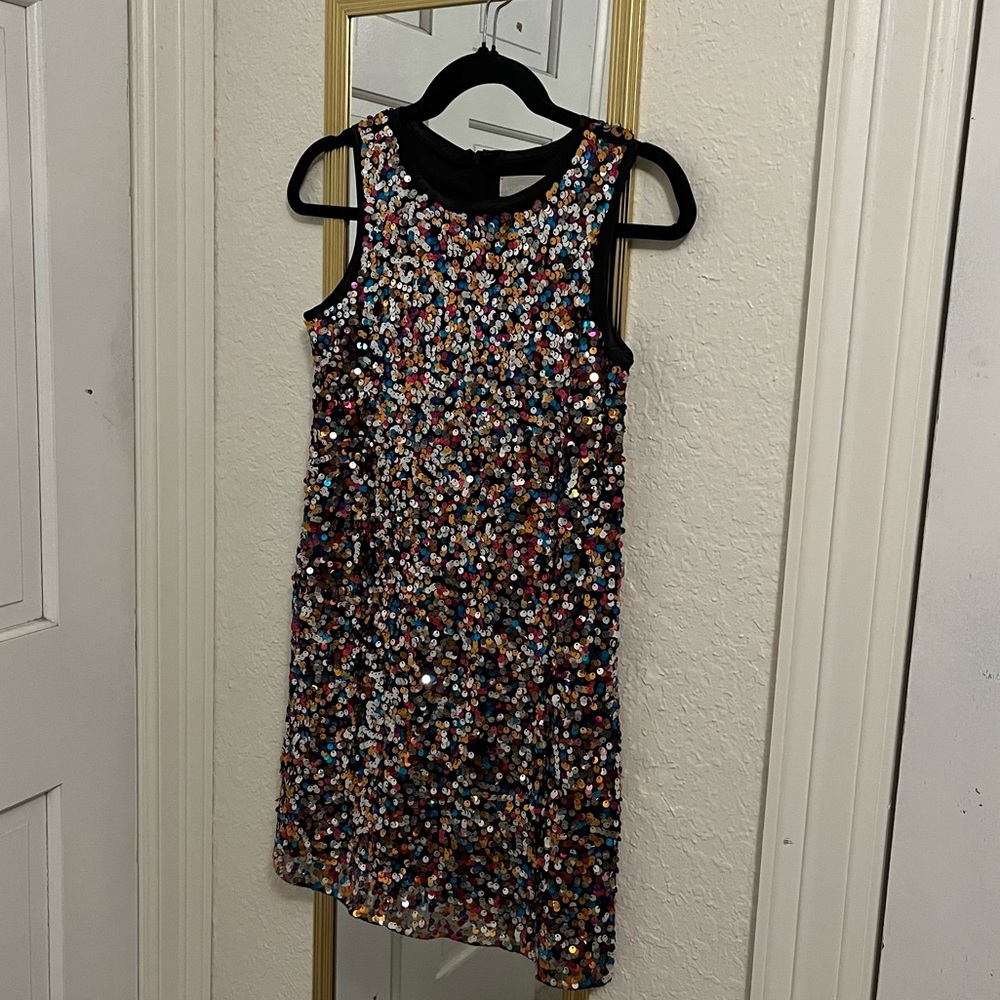 10/12 kids dress but fits an XS to S women’s. Sparkle sequins and stretchy.
